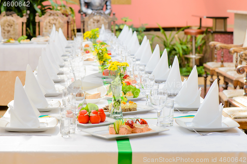 Image of Long served table with dishes