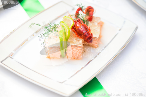 Image of Fish dish with slice of lime, jelly and crayfish
