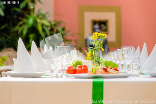 Image of Long served table with dishes