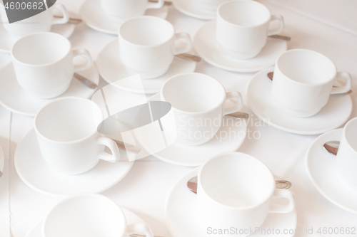 Image of Group of white coffee cups in cafe bar