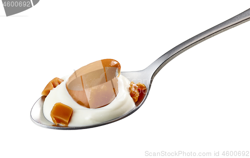 Image of spoon of yogurt and soft caramel