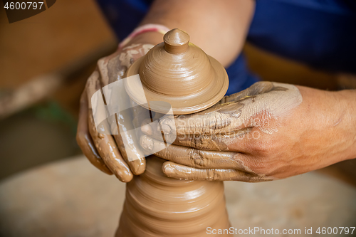 Image of Potter at work makes ceramic dishes. India, Rajasthan.