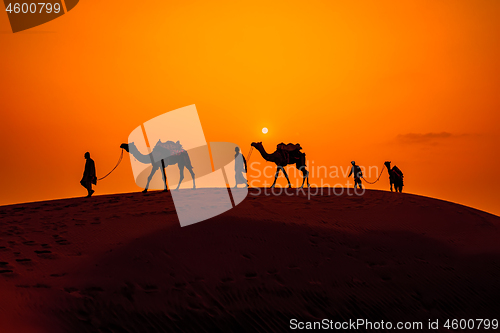 Image of Cameleers, camel Drivers at sunset. Thar desert on sunset Jaisal