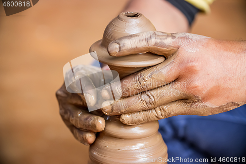 Image of Potter at work makes ceramic dishes. India, Rajasthan.