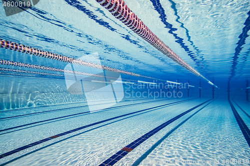 Image of Olympic Swimming pool under water background.