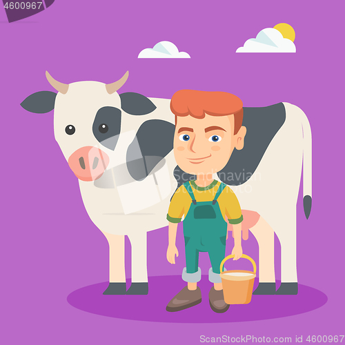 Image of Little caucasian farmer boy milking a cow.