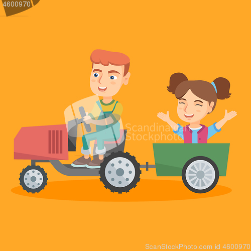 Image of Boy driving a tractor with his friend in trailer.