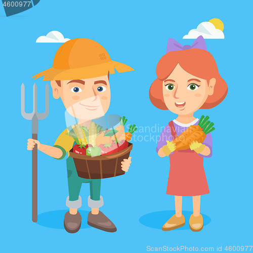 Image of Little boy and girl holding fruit and vegetables.