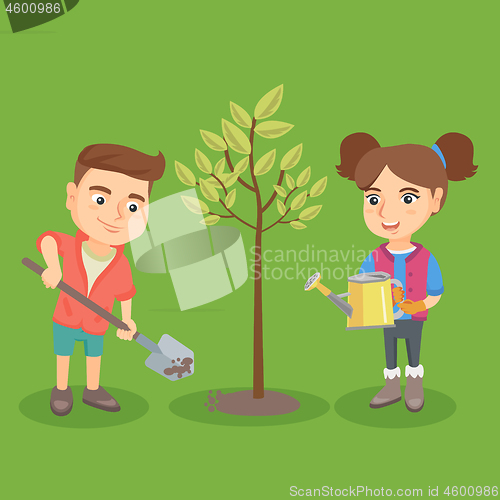 Image of Little caucasian boy and girl planting the tree.