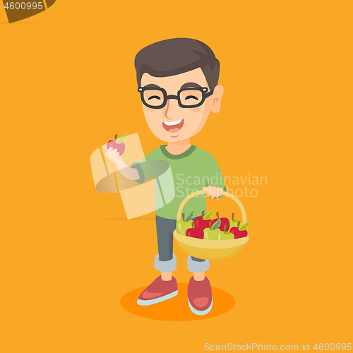 Image of Little caucasian boy holding basket with apples.