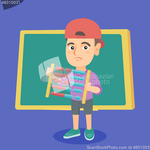 Image of Boy with abacus on the background of blackboard.