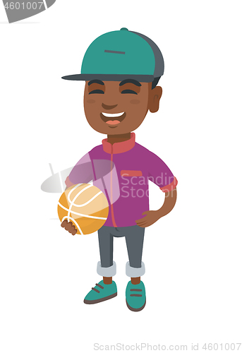 Image of Laughing schoolboy holding a basketball ball.