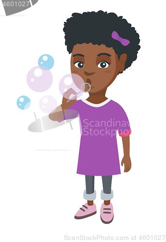 Image of Little african-american girl blowing soap bubbles.