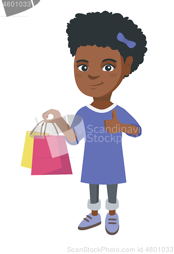 Image of Happy african-american girl holding shopping bags.