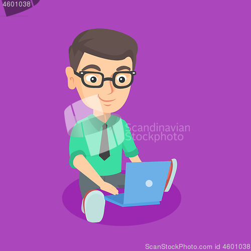 Image of Caucasian kid businessman working on a laptop.