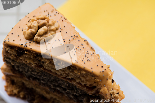 Image of A piece of cake with condensed milk on a plate