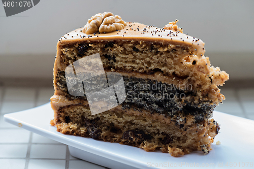 Image of A piece of cake with condensed milk on a plate