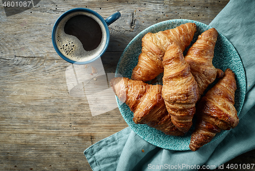 Image of freshly baked croissants and coffee