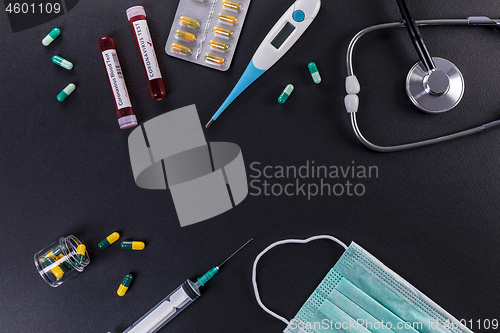 Image of Blood test tube with the Coronavirus disease for virus test and 