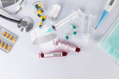 Image of Blood test tube with the Coronavirus disease for virus test and 