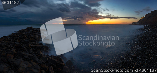 Image of Panorama of three frames a general view of the rocky shore of the Black Sea coast after sunset, Anapa, Russia