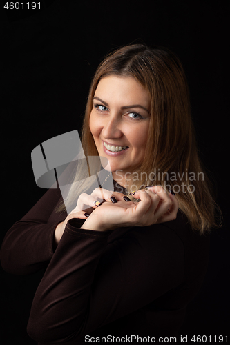 Image of Portrait of a smiling thirty-year-old girl of European appearance