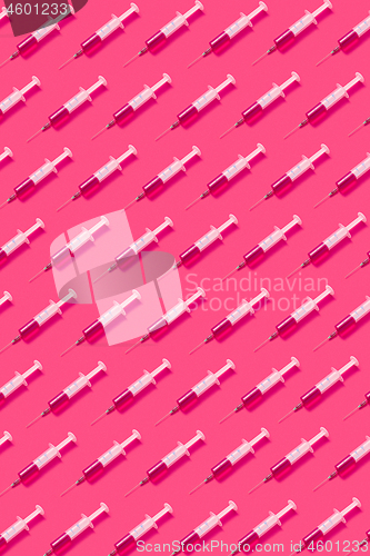 Image of Health pattern of disposable syringes with injectable liquid.