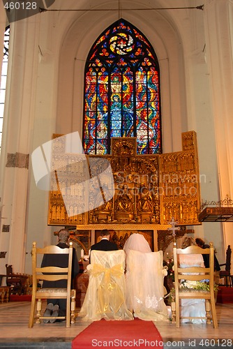 Image of Young couple at the altar