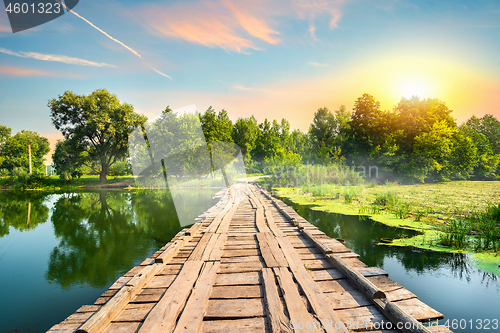 Image of Wooden bridge at sunset