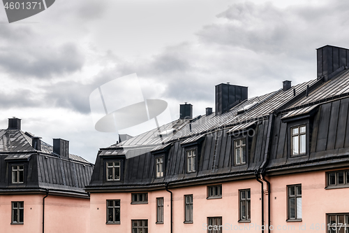 Image of Pastel colored buildings with black roofs