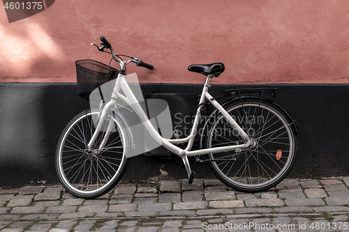 Image of Bicycle near pink and black wall