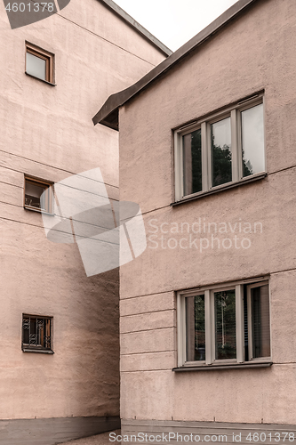 Image of Two stone pastel colored buildings