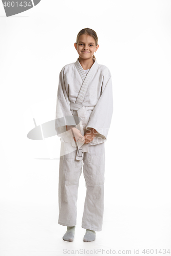 Image of Funny and humble girl in a kimono, isolated on a white background