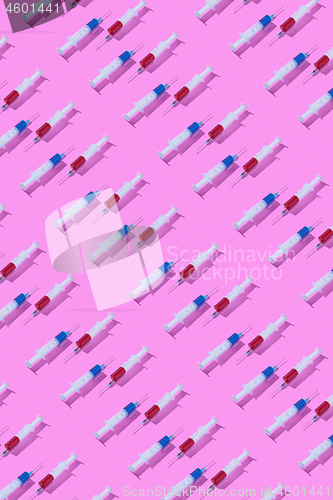 Image of Medical pattern from surgical syringes with injectable drugs.