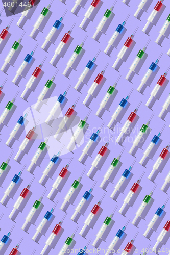 Image of Medical pattern from plastic multicolored disposable syrenges.