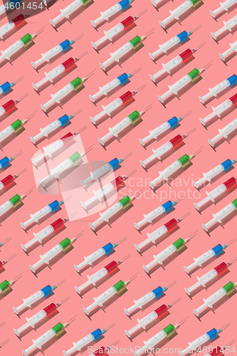 Image of Health pattern of disposable syringes with colored drugs.