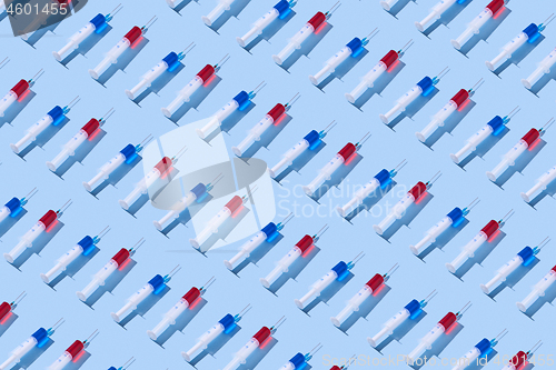 Image of Medicinal pattern from syringes with red and blue serum.
