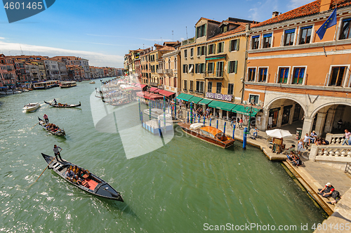 Image of Venice, Italy. Small passenger ship carries tourists across the city