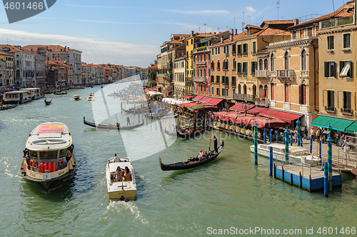 Image of Venice, Italy. Small passenger ship carries tourists across the city