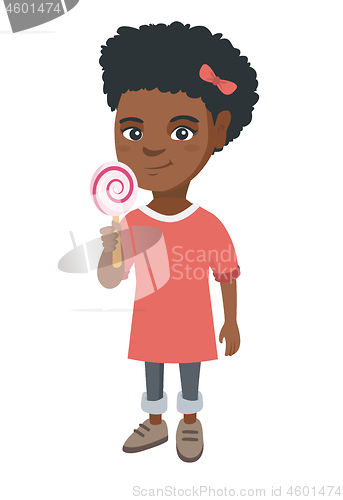 Image of Little african girl holding a lollipop candy.