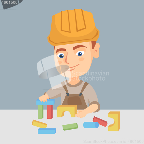 Image of Boy playing in the builder with building cubes toy