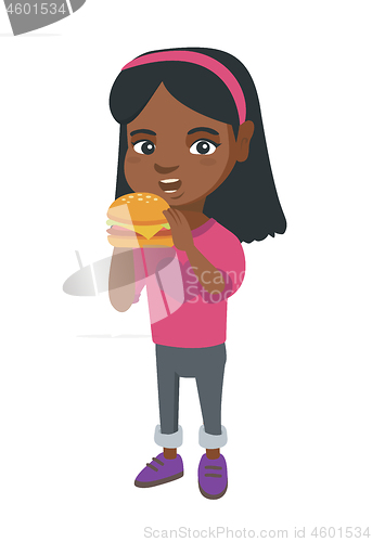 Image of Little african-american girl eating a hamburger.