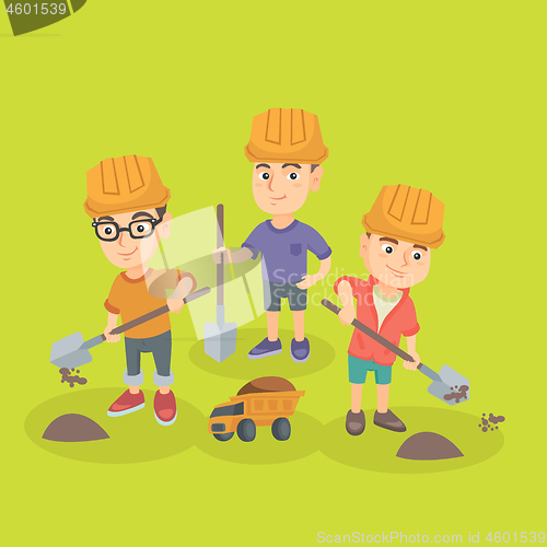 Image of Little boys playing with sand, spade and toy truck