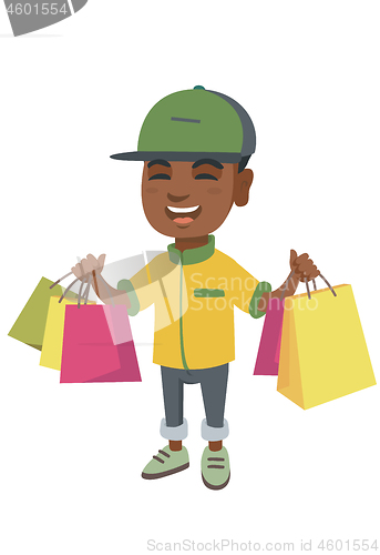 Image of Happy african-american boy holding shopping bags.