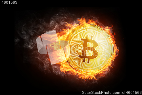 Image of Golden bitcoin coin flying in fire flame.