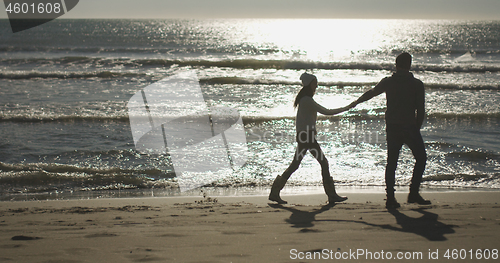 Image of Romantic Couple Relaxing On The Beach