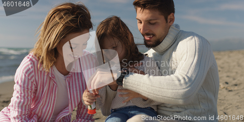 Image of Young family enjoying vecation during autumn