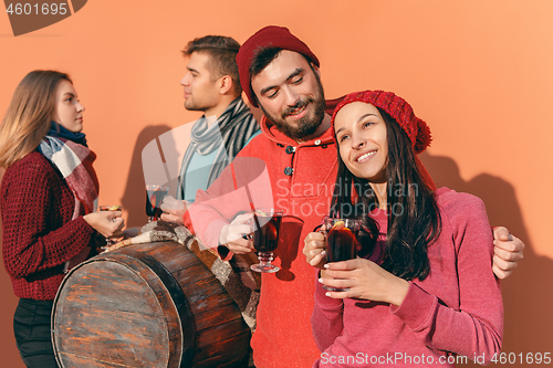 Image of Smiling european men and women during party photoshoot.