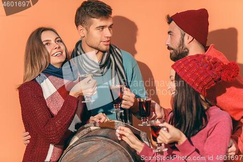 Image of Smiling european men and women during party photoshoot.