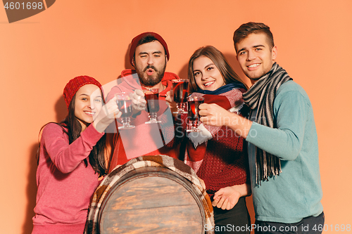 Image of Smiling european men and women during party photoshoot.